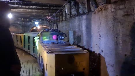 underground-train-drives-away-while-we-can-see-electricity-sparks-flying-in-coal-museum-in-Estonia-Ida-virumaa-Kaevandus-Muuseum