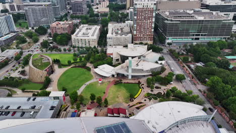 Aerial-view-of-park-and-futuristic-design-building-in-city