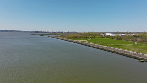 Drone-flight-over-Upper-Bay-and-Liberty-State-Park-with-blue-sky-and-sunny-day-in-Jersey-City