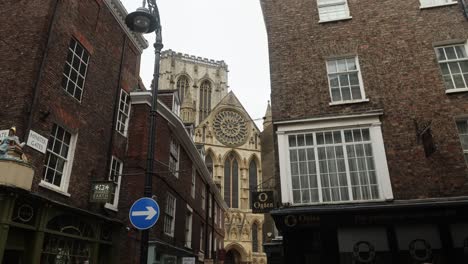 Slow-tilting-shot-of-people-walking-through-York-city-centre-with-the-Minster