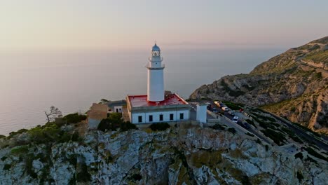 Stunning-aerial-of-Formentor-Lighthouse-with-the-sun-reflecting-at-sea