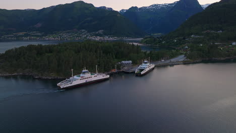 Sustainable-travel-in-Norwegian-fjord---aerial-orbit-of-electric-car-ferry