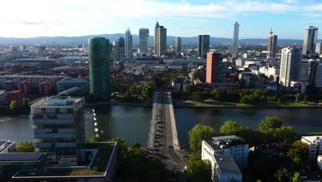 Wide-angle-flyover-above-cars-commuting-into-Downtown-Frankfurt-Germany-at-midday