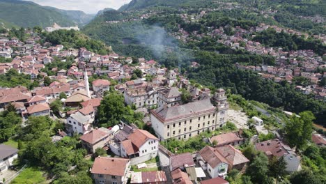 Aerial:-Jajce-Kasarna,-Sarajevo,-nestled-amid-green-hills