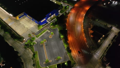 High-angle-view-of-illuminated-infrastructure-at-shopping-park-at-night