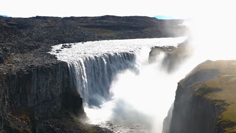 Aerial-rising-shot-of-Gullfoss-Falls-flowing-powerfully-through-a-canyon-in-Iceland