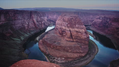 Pan-up-to-big-bend-in-canyon-river-valley