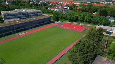 Mistelbach,-Niederösterreich,-Austria---Green-and-Sprawling-Football-Field---Aerial-Panning