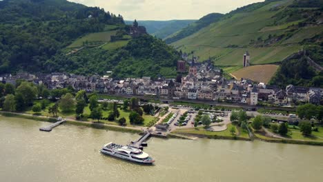 Aerial-townscape-of-german-town-Bacharach-at-river-rhine-foothills,-Germany