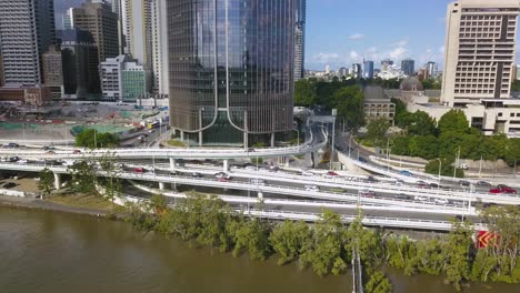 Traffic-on-highway-exchange-on-ramp-next-to-river-and-downtown-district-of-Brisbane