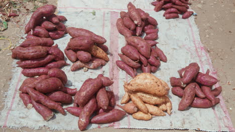 Sweet-potatoes-for-sale-at-an-outdoor-market