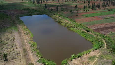 Aerial-View-Of-Dam-In-The-Field-For-Irrigation-System
