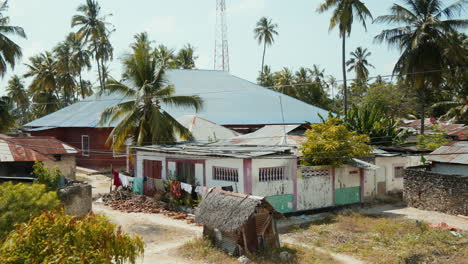 Rustic-village-scene-with-tropical-palms-in-Jambiani,-Zanzibar