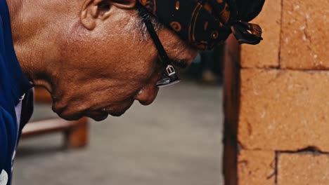 An-elderly-Indonesian-man-and-ring-maker-works-in-concentration
