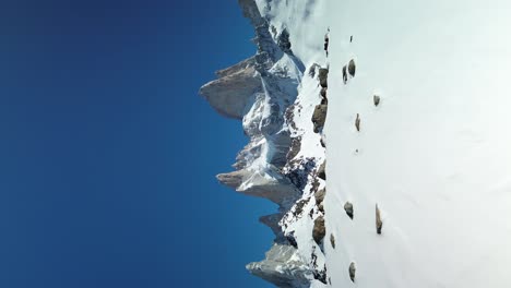 Snowy-Patagonia-Fitz-Roy-Mountain,-Vertical-Cinematic-Aerial-Reveal