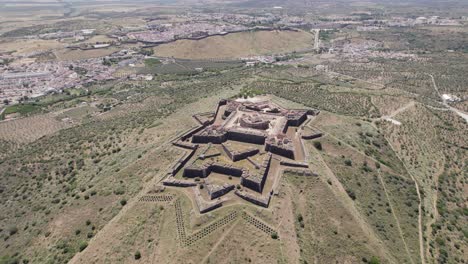 Strategic-symmetrical-fortress-Nossa-Senhora-da-Graça-Fort-in-Elvas,-Portugal,-circling-aerial