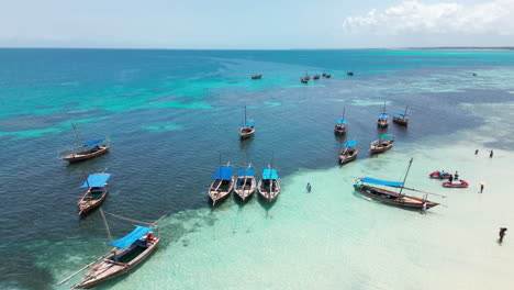 Traditional-tourist-boats-moored-in-clear-tropical-waters