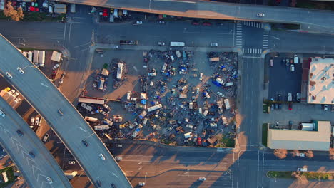 Homeless-camp-under-the-highway-overpass-in-Oakland,-California---straight-down-aerial-view
