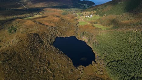 Aerial-over-the-lakes-and-rugged-and-hills-near-Lauvstad-in-the-Volda-Municipality,-Norway