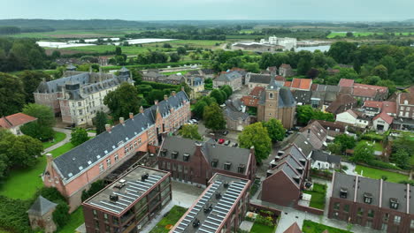 Aerial-Pullback-Oud-Rekem-Town-Center-with-Poortgebouw-and-Castle