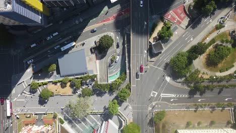 Aerial-birdseye-flying-over-Brisbane-city-center-on-sunny-day,-Queensland,-Australia