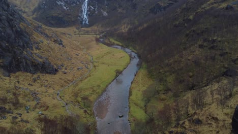 Cinematic-drone-video-in-4K-of-incredible-Scottish-landscape-and-big-waterfall-in-autumn---Steall-Falls-in-Glen-Nevis-Valley,-Scotland,-UK