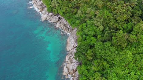 Phuket-Island’s-Stone-Coast,-Green-Forests,-and-Blue-Waters:-A-Breathtaking-4K-Drone-Flight-Over-Tropical-Paradise