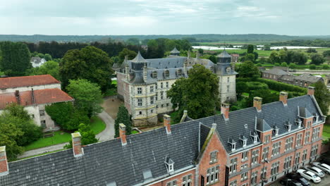 The-Aspremont-Lynden-Castle-in-Oud-Rekem-Village,-Aerial-Orbit