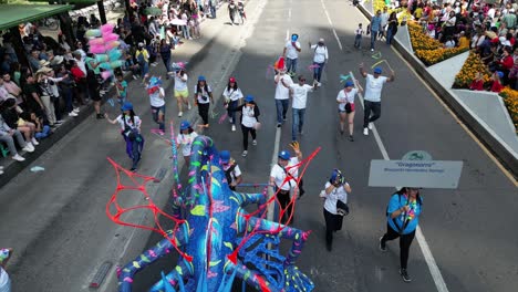 Dron-footage-of-mexicans-walking-with-big-alebrijes-during-the-mexican-alebrije-parade