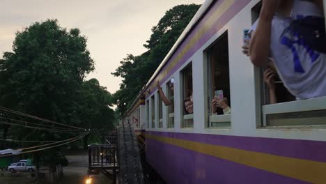 Train-going-past-camera-on-Burma-Railway-or-Death-Railway-in-Thailand
