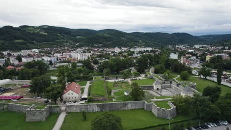 Aerial:-Kastel-Fortress,-Banja-Luka-with-city-and-mountains-backdrop