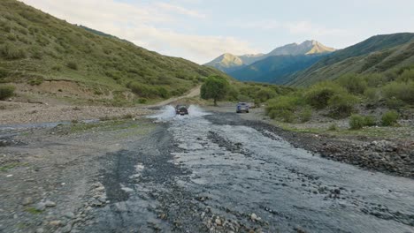 Driving-Across-The-Creek-On-The-Mountains-Near-Saty,-Kazakhstan,-Central-Asia