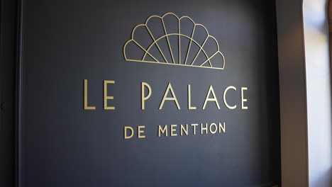 Entrance-sign-of-Palace-de-Menthon-luxury-hotel-in-the-Alpine-lake-area,-Close-up-shot