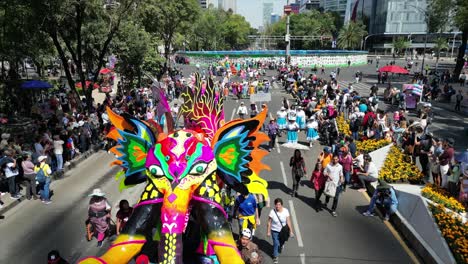 Drone-footage-of-an-amazing-colorful-alebrije-during-the-Mexico-city-alebrije-parade