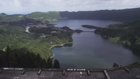 Tourist-atop-Monte-Palace-overlooking-São-Miguel's-lagoon,-Azores