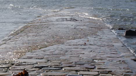 wide-shot-of-the-tide-revealing-the-Causeway-at-St-Michaels-mount