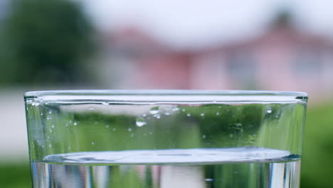 Ripples-and-waves-formed-by-droplets-of-liquid-that-fall-into-a-glass-filled-with-water