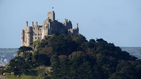 Mid-shot-of-mediaeval-castle-on-St-Michael's-mount-taken-from-the-village-of-Marazion