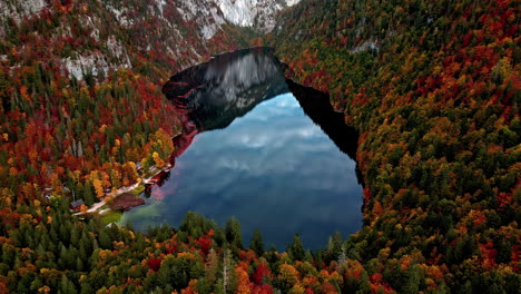 Aerial-view-of-the-Lake-Toplitz,-reflecting-in-middle-of-fall-colored-mountains