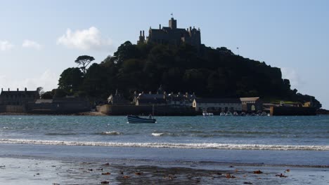 wide-shot-of-Sir-Michael's-mount-silhouetted-in-the-sun-taken-from-Marazion-beach