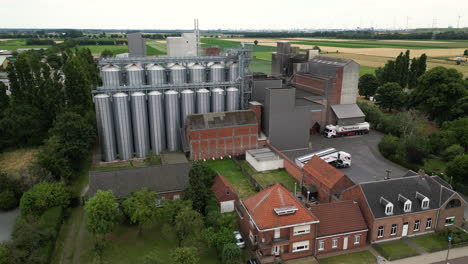 Rural-town-with-massive-new-grain-silos,-aerial-view
