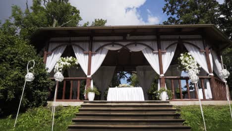 Slow-zoom-on-Jaunmoku-castle-wedding-arbor-ceremony-place-in-forest
