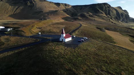 Church-Chapel-in-Breathtaking-Iceland-Mountain-Landscape-in-Vik,-Aerial