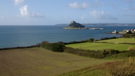 extra-wide-panning-shot-of-St-Michael's-mount-with-the-village-of-Marazion-right-of-frame