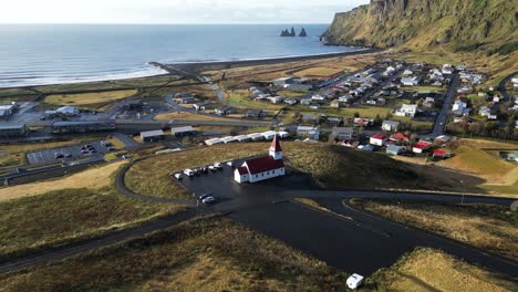 Picturesque-Church-Building-in-Town-of-Vik,-Iceland---Aerial-Drone-View
