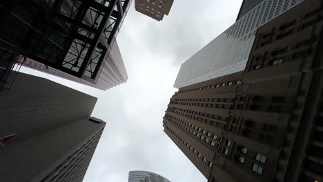 Upward-view-of-Toronto's-diverse-skyscrapers-on-a-cloudy-day