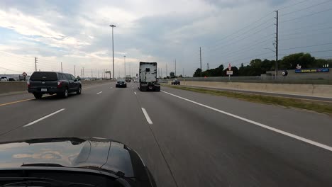 POV-car:-Canadian-highway-with-vehicles-and-overcast-sky