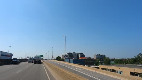 Car-POV:-Highway-scene-with-Montreal-cityscape-and-traffic