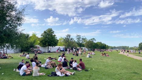 People-on-Relaxing-Sunday-in-Mauerpark-of-Berlin-with-Flea-Market-in-Background