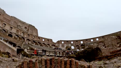 Looking-Up-At-Brickwork-On-Walls-And-Amphitheatre-Ruins-From-The-Underground-Tunnels-At-The-Colosseum-In-Rome